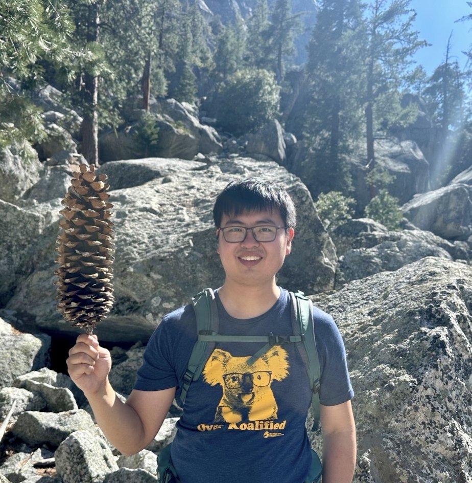 Hiking in Kings Canyon, holding a giant pine cone