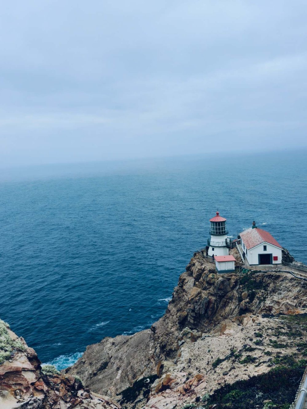 The lighthouse at Point Reyes above the ocean